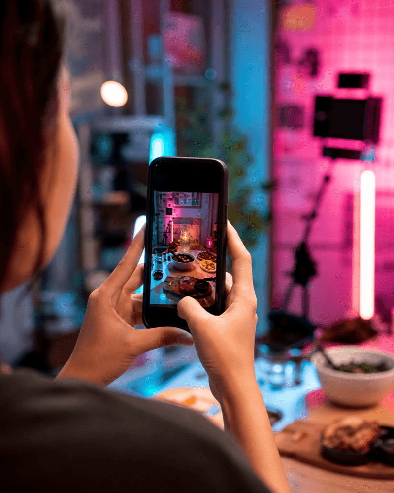 Creator filming food content at a night market